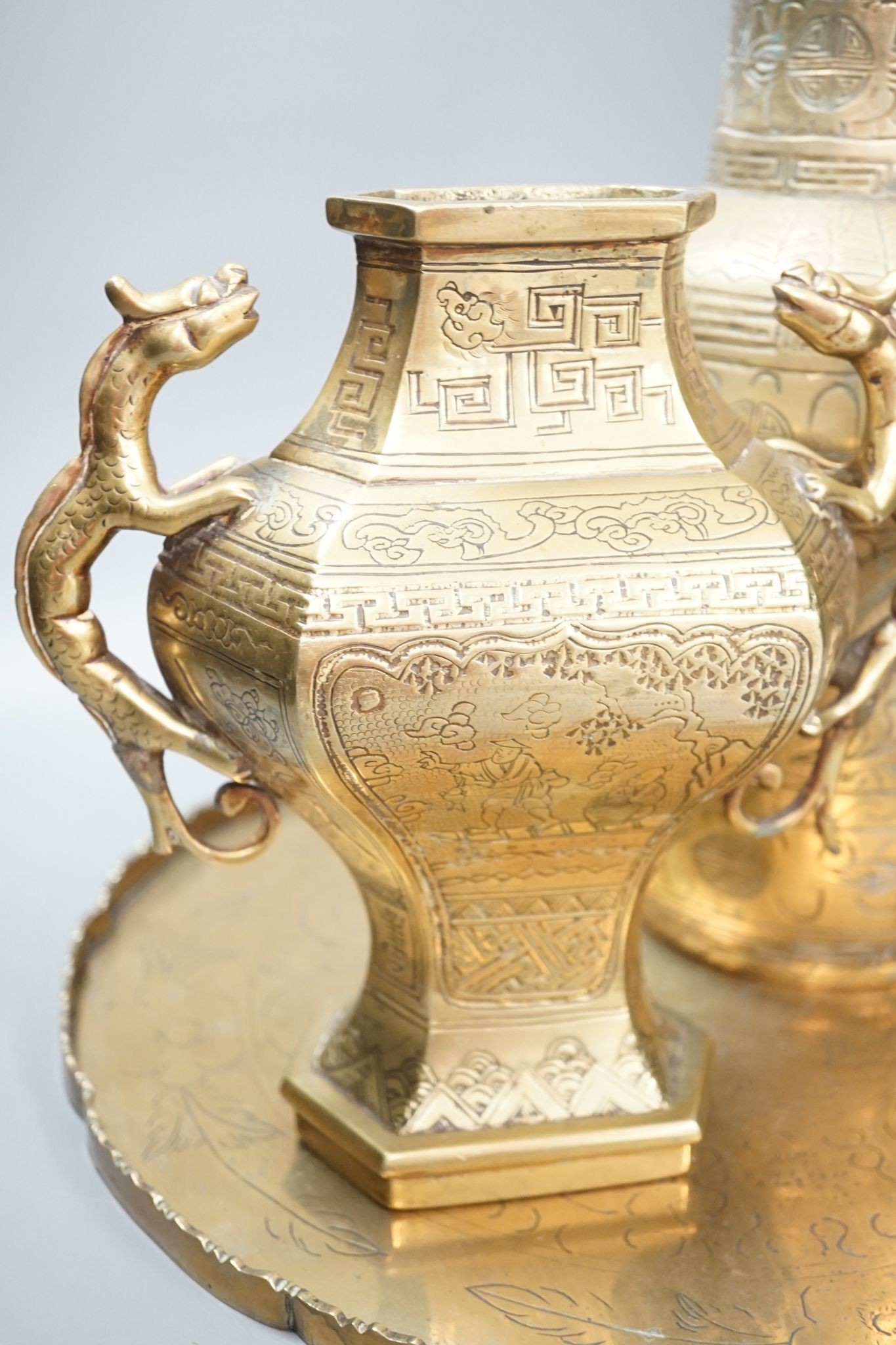 Two early 20th century Chinese bronze vases and a similar tray, 35cm diam.